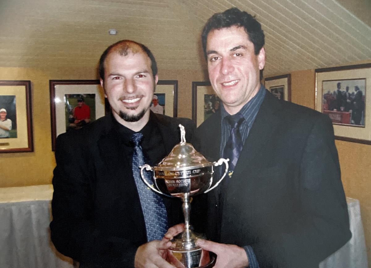 Midlands Captain Andy Avraam presenting VCGS Victorious Captain Akis with Cyprus Cup Trophy