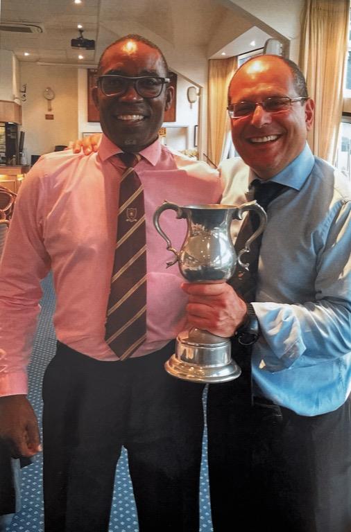 CGS V ACGS - The Captain being presented with Trophy from ACGS Captain