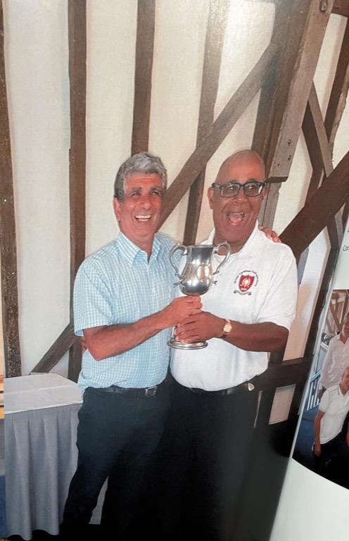 CGS V ACGS - Stand in Captain Savva Savva receiving Trophy from ACGS Captain